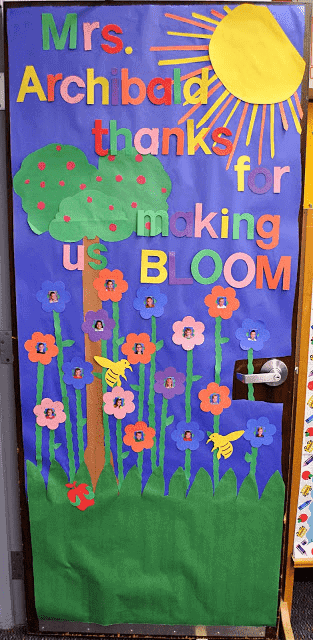 classroom door decorated with flowers